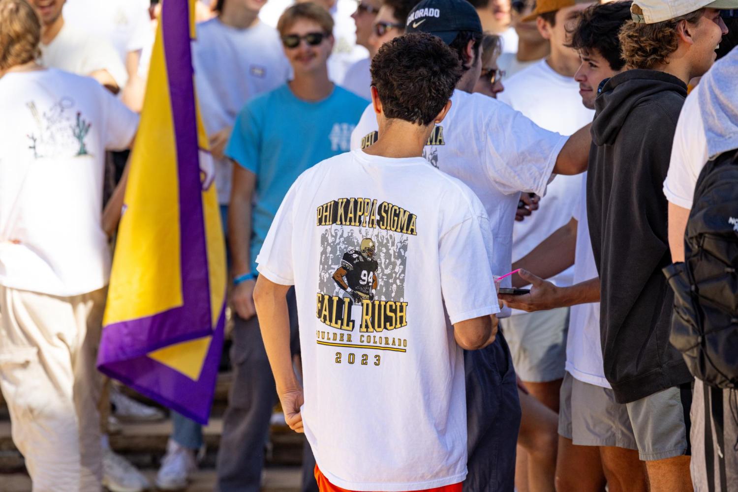 male student in Fall Rush t-shirt