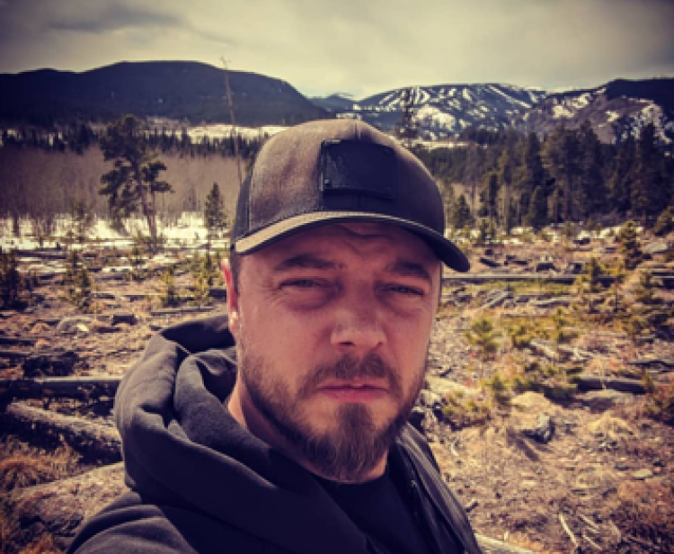 Mathias Nordvig with mountains in background