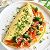 Egg omelet filled with tomatoes, onions and broccoli