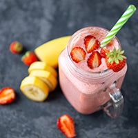 Strawberry banana oatmeal smoothie in a mason jar