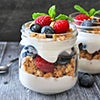 Yogurt parfait layered with berries and granola