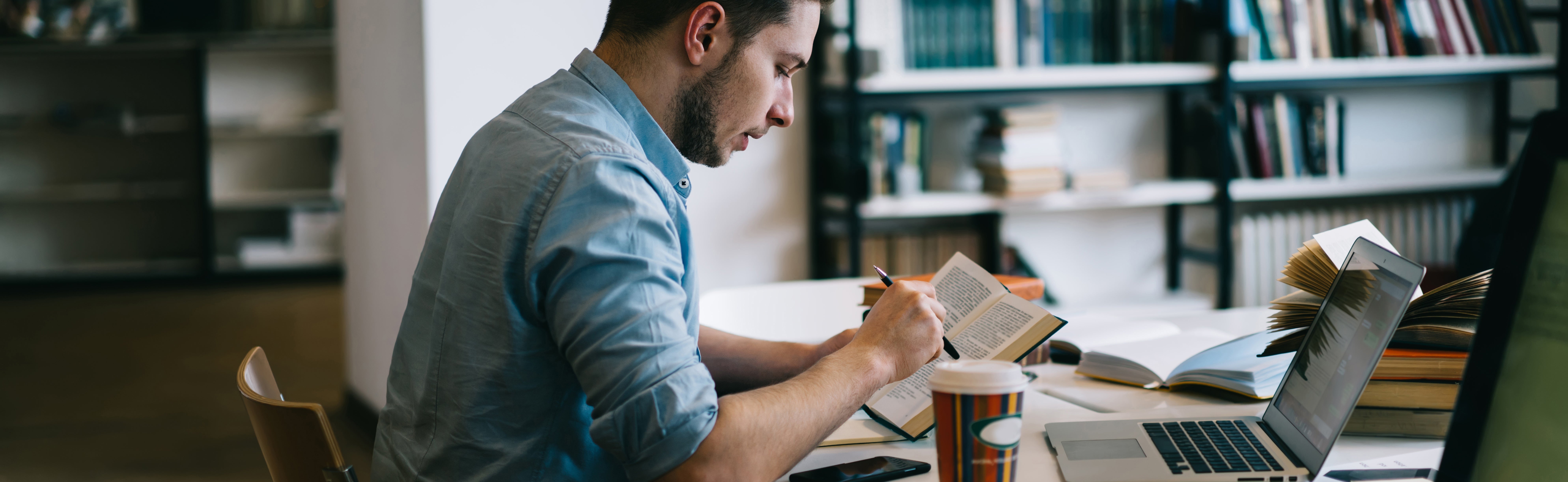 Photo of a student studying hard in preparation for midterms.