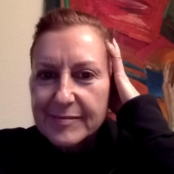 woman with her hand on her head