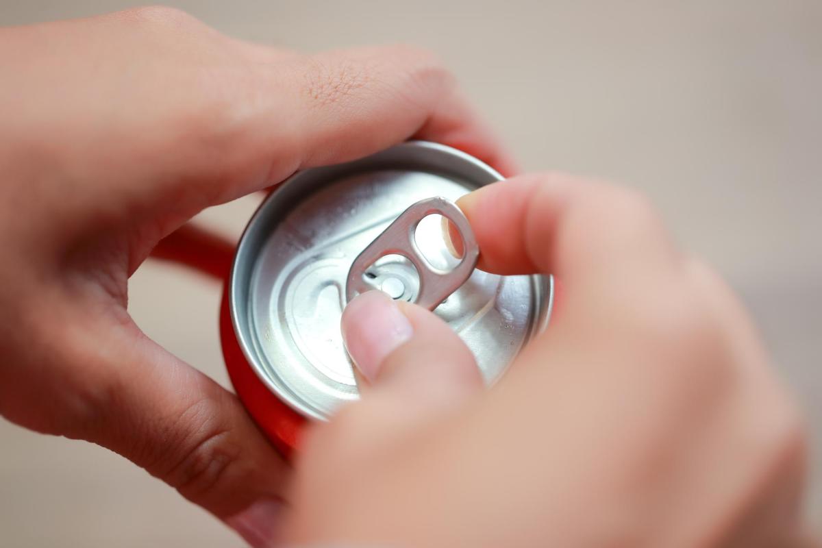 Photo of a person opening a closed container.