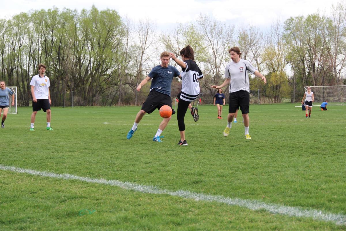 Students playing outdoor soccer