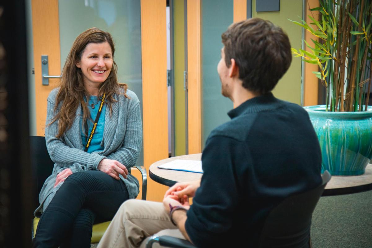 Photo of a student meeting with a CAPS counselor.