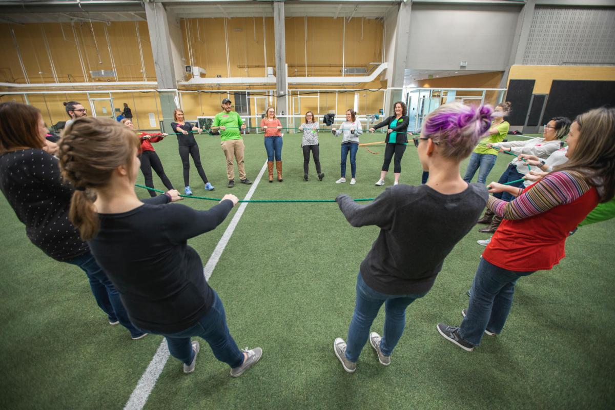Photo of a working team at the challenge experience in the rec center.