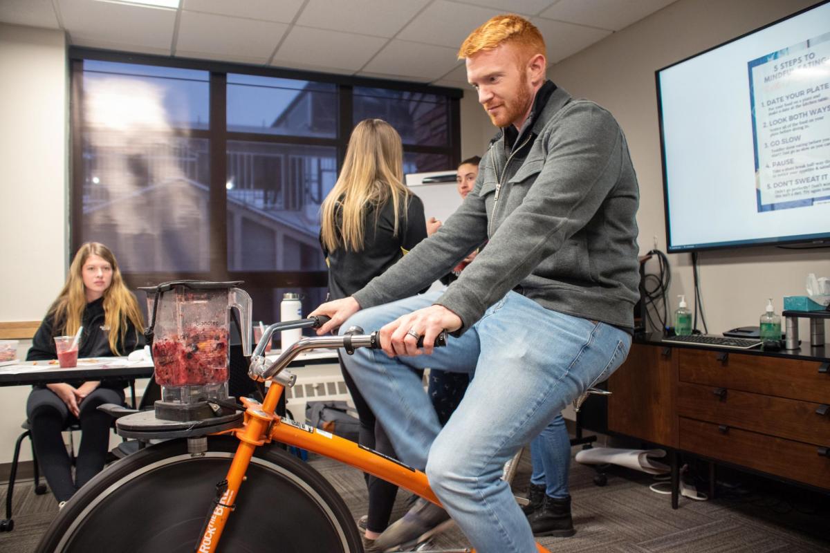 man riding an indoor bike