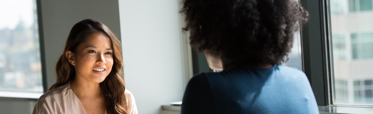 Photo of a student meeting with a mental health provider to ask questions about therapy.