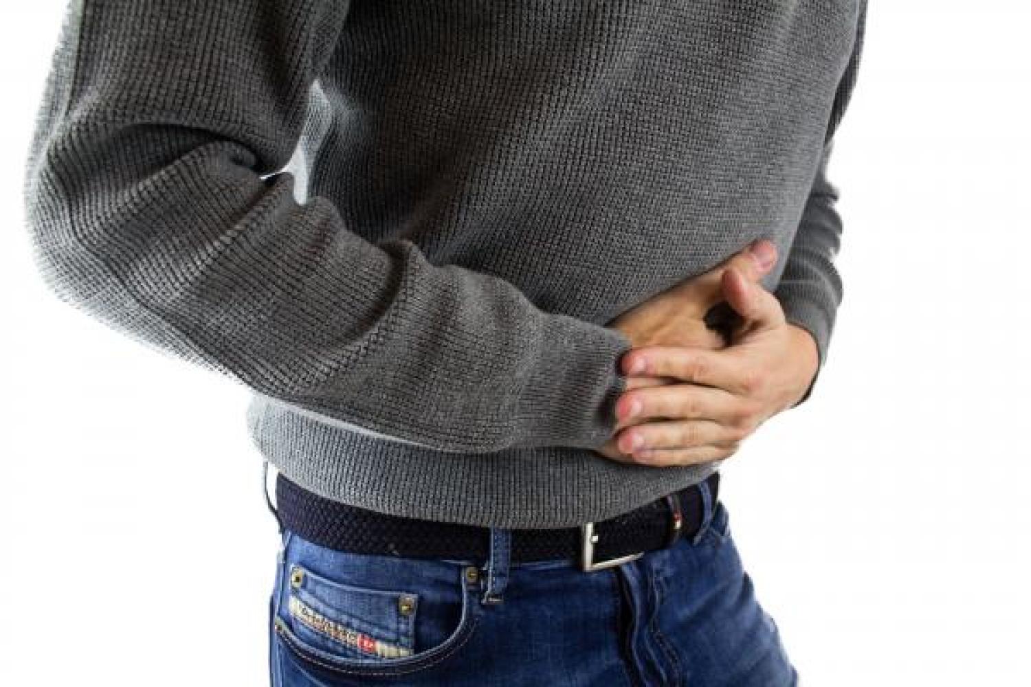 Man clutching stomach