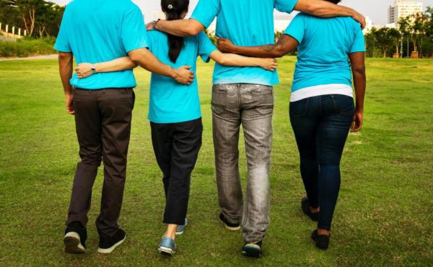 people with arms around each other