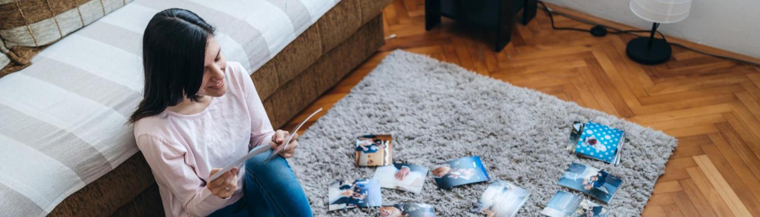 Woman looking through old family photos