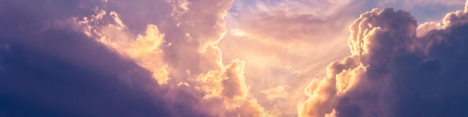 Sun peaking through storm clouds