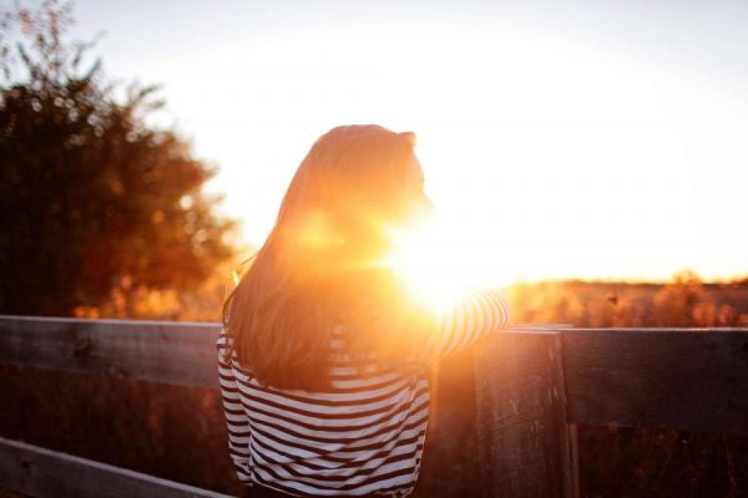 Girl blurred by sunlight