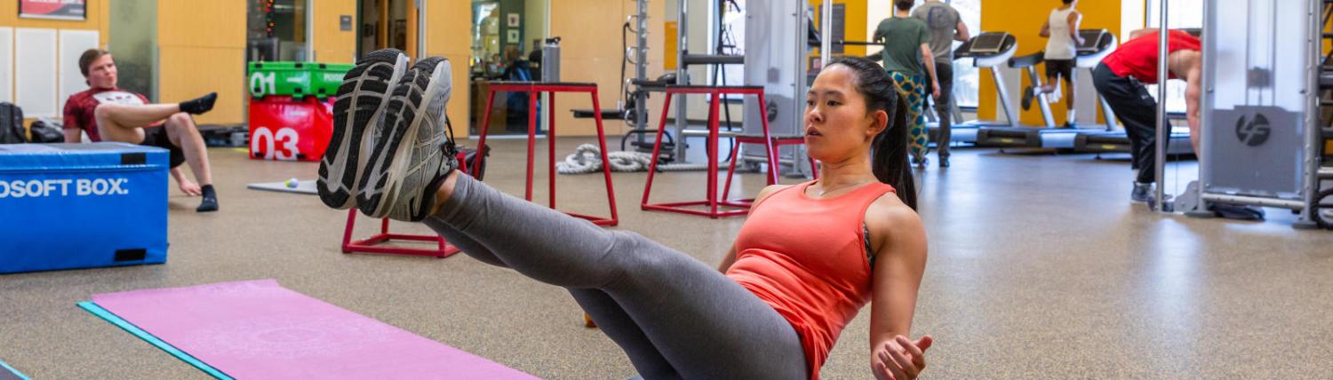 Girl doing a core workout at the rec center