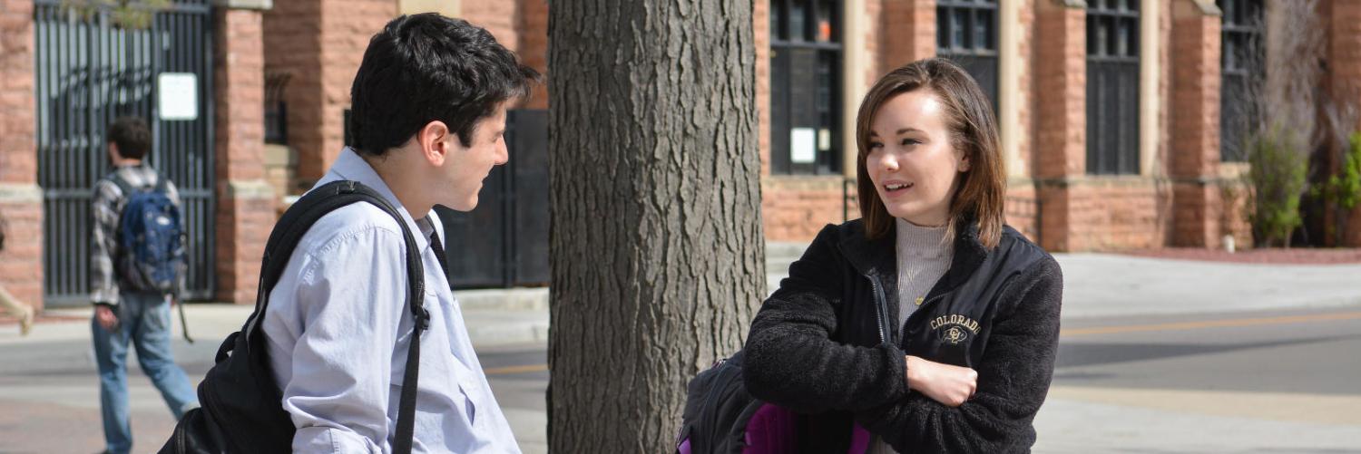 Two students talking outside