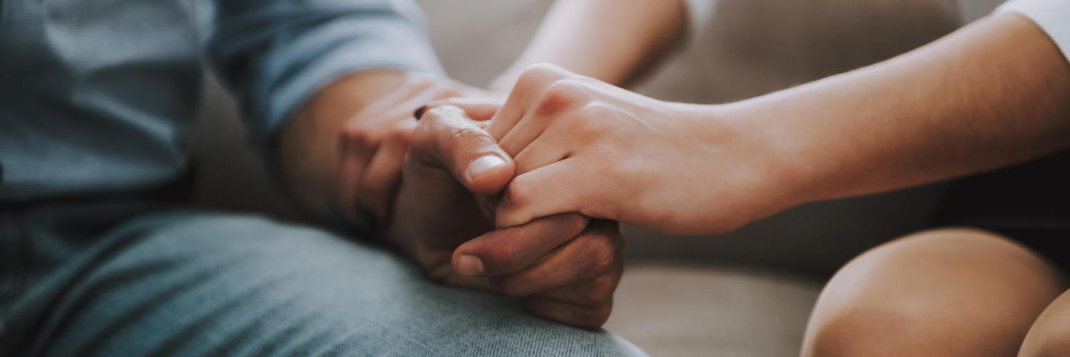 two people holding hands