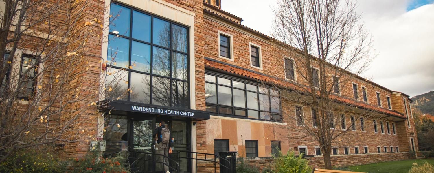 Outside of Wardenburg Health Center in the fall