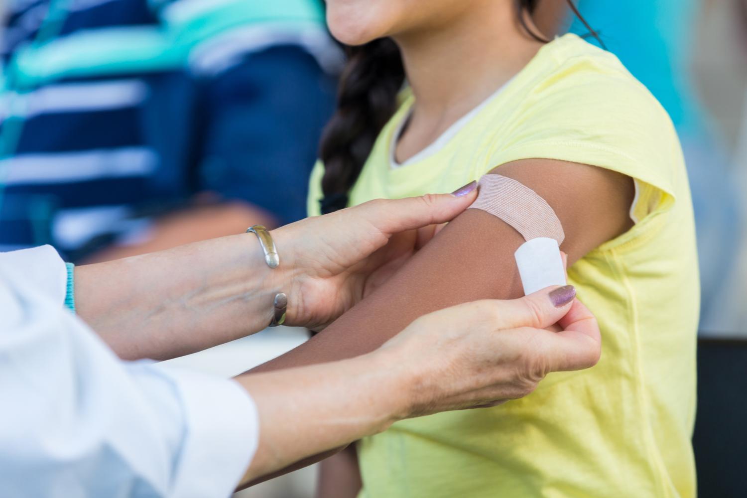 student receiving vaccine