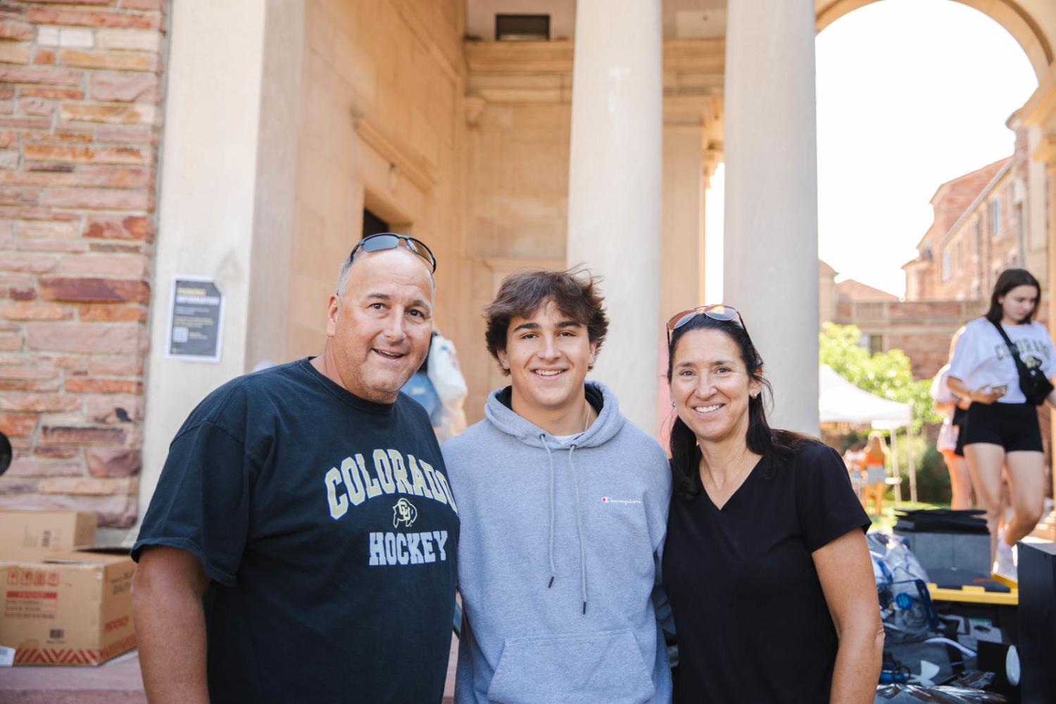 family in front of arches