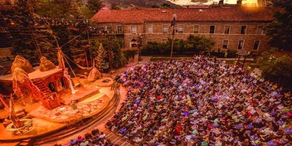 Aerial photo of the shakespeare festival stage and crowd at CU Boulder. 