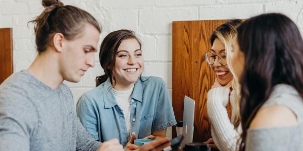 Photo of students meeting together in a casual setting.