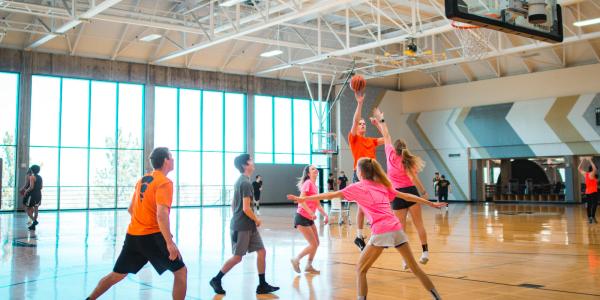 Photo of students participating in a 3v3 basketball game during Jam Fest.