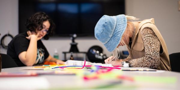 Photo of students working on a workshop activity.