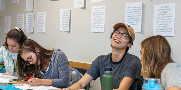 Photo of students laughing together during a workshop.