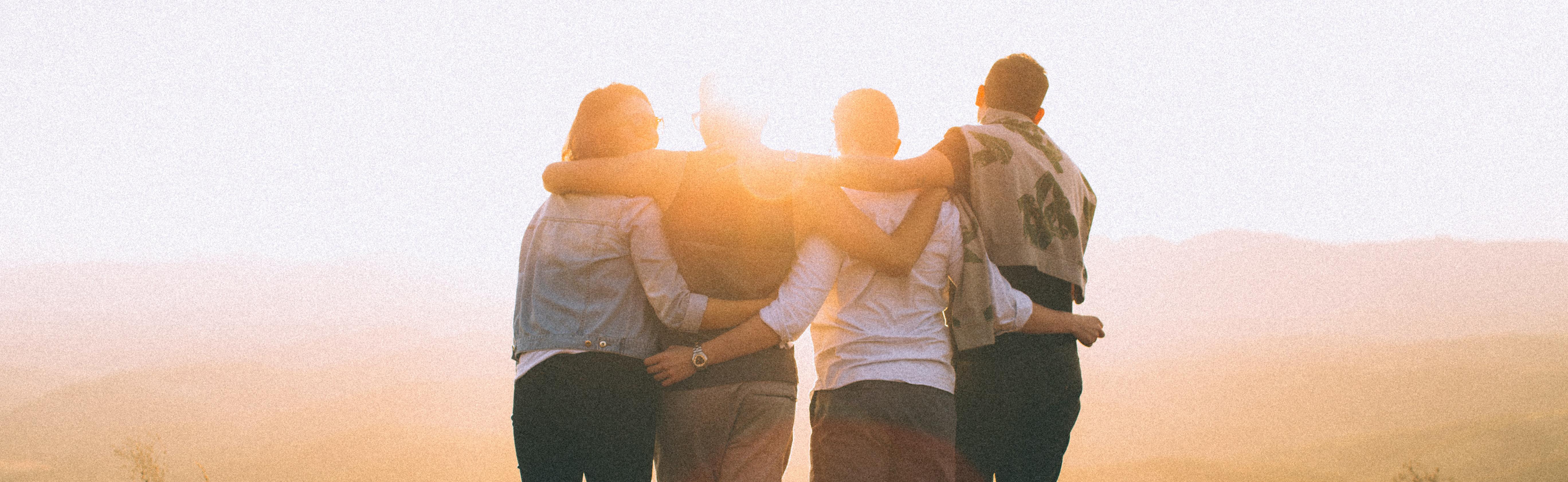 Friends with their arms around eachother