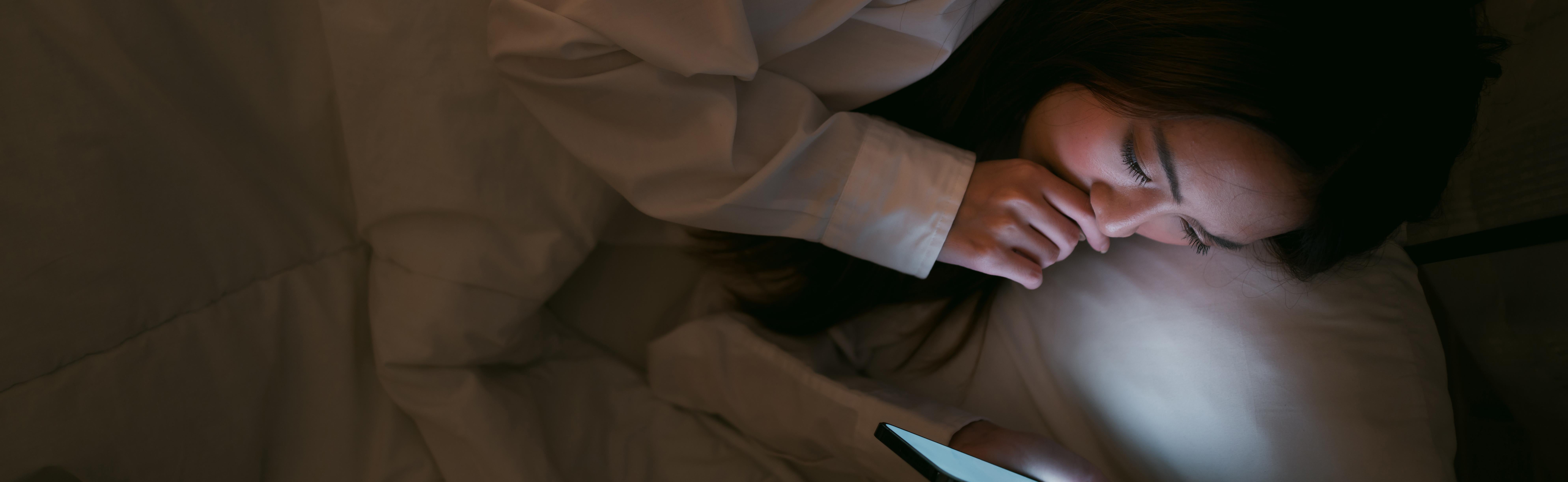 A female looking at her phone