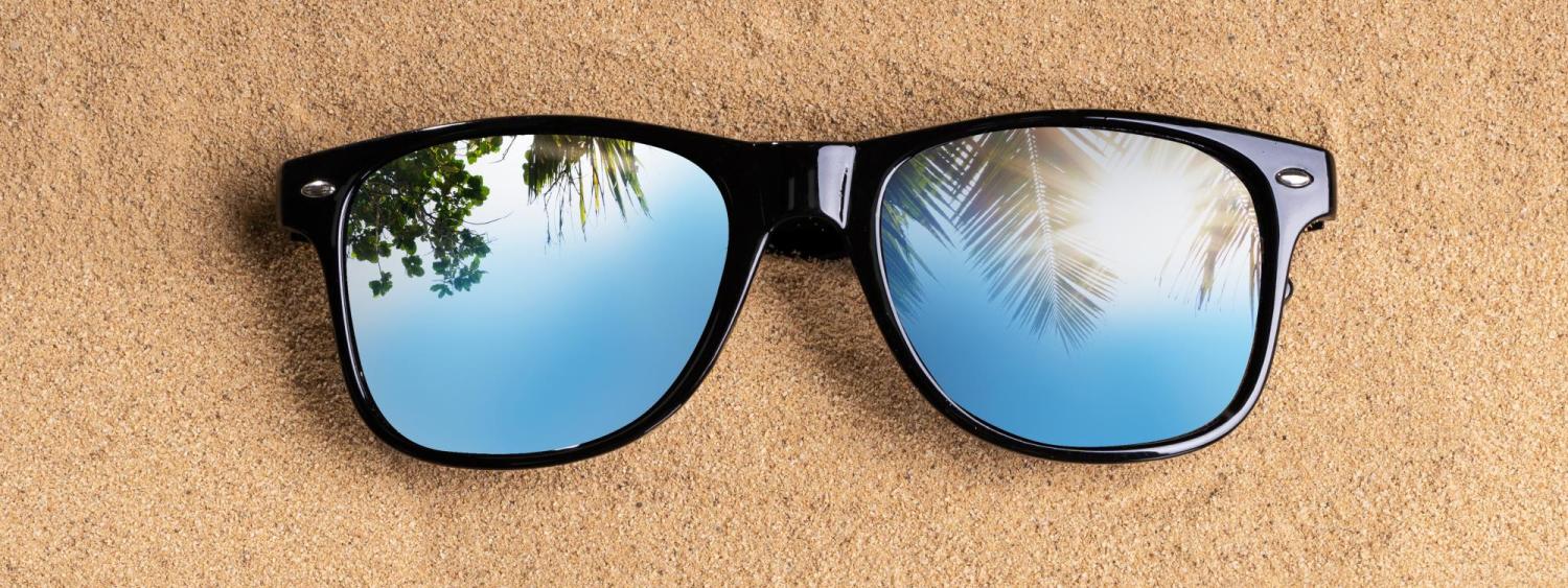 Sunglasses on sand