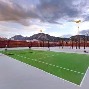 Photo of students playing on the rooftop tennis courts.