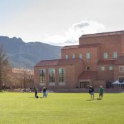 Panoramic view of farrand field with students hanging out outside.