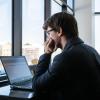 A person sitting looking at a computer