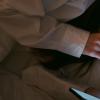 A female looking at her phone