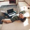 man sleeping with computer