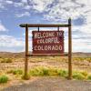 Photo of the "Welcome to Colorful Colorado" sign on a sunny bright day.
