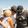 student hugging parents