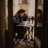 Woman with books writing