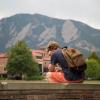 Photo of a student looking sullen on a bench at Farrand Field.