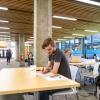 Photo of students studying for finals at tables in the engineering building.