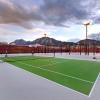 Photo of students playing on the rooftop tennis courts.