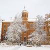 Photo of Old Main dusted in snow.