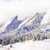 Photo of the flatirons covered in snow.