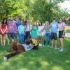 Photo of a group of students posing with Chip the Buffalo on Farrand Field.