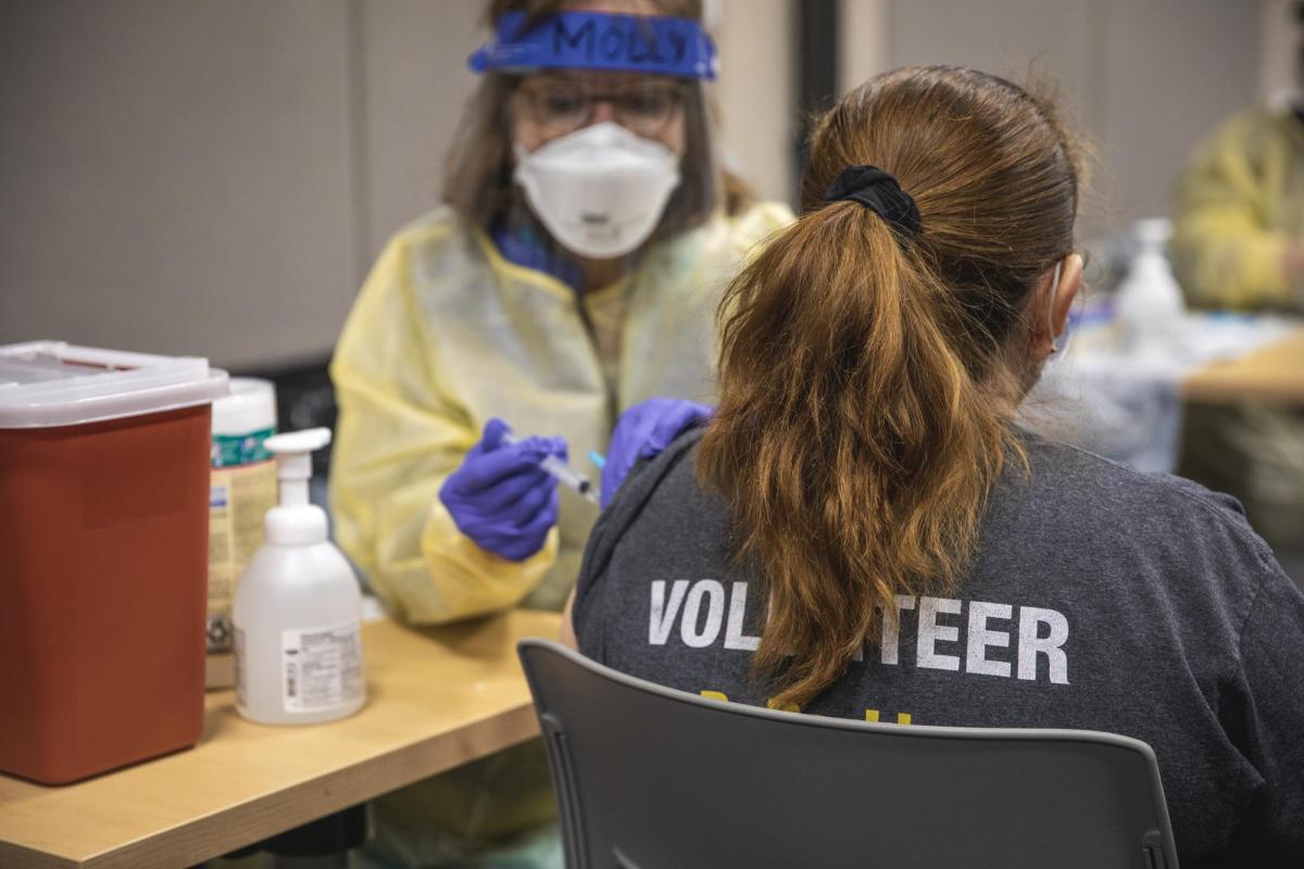 an individual getting a vaccine