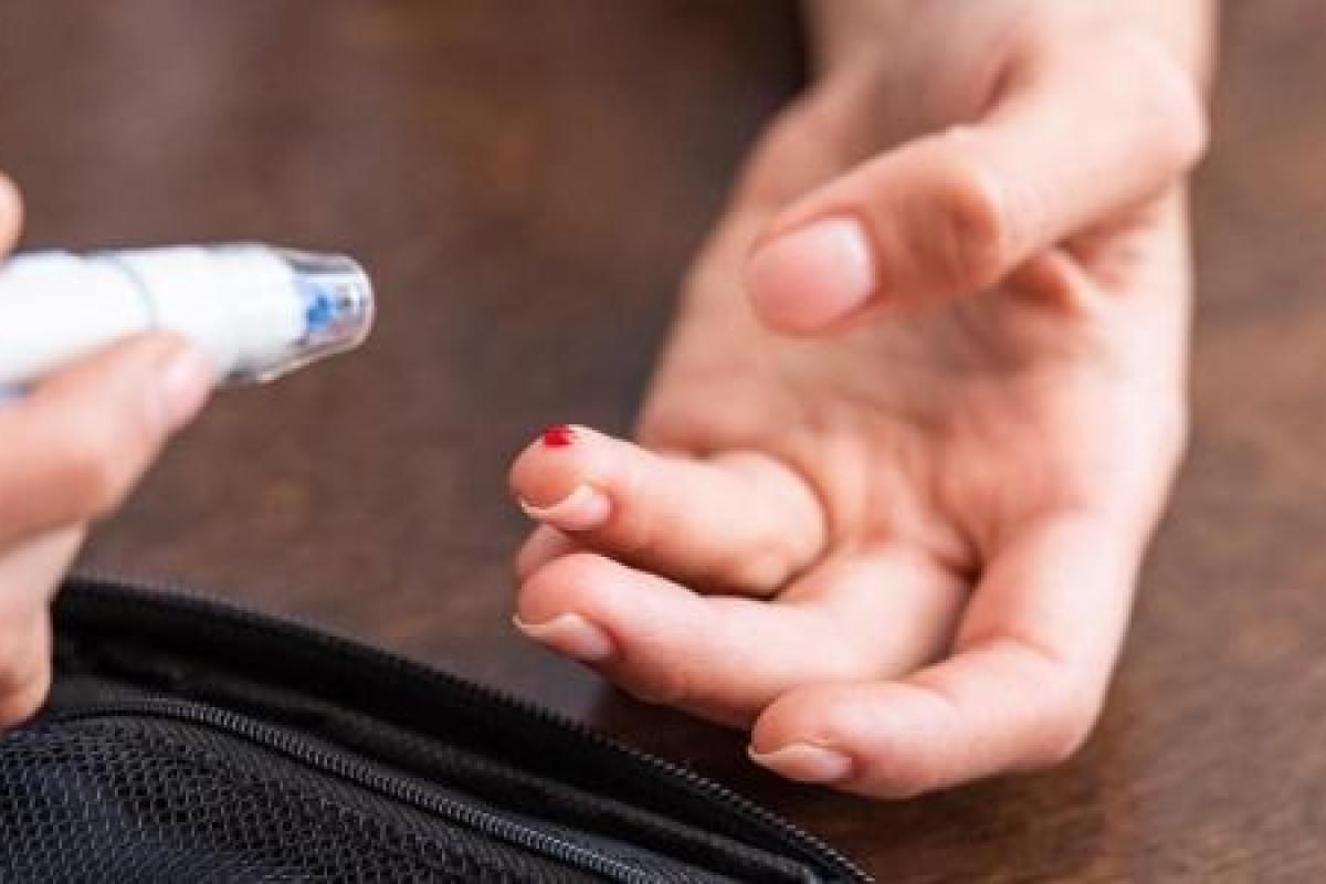 A finger bleeding from a testing device