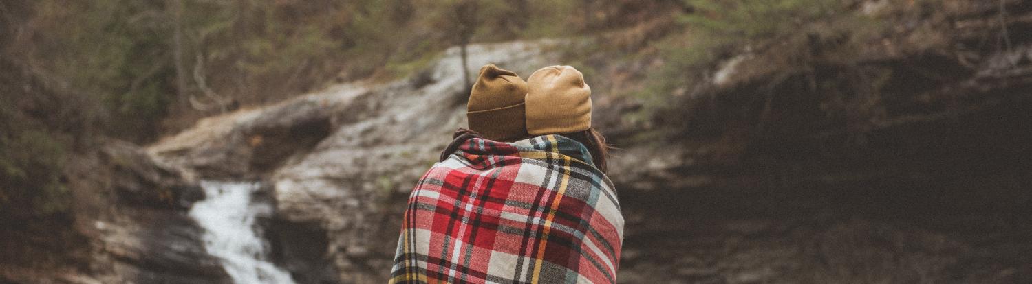Couple outside wrapped in a blanket