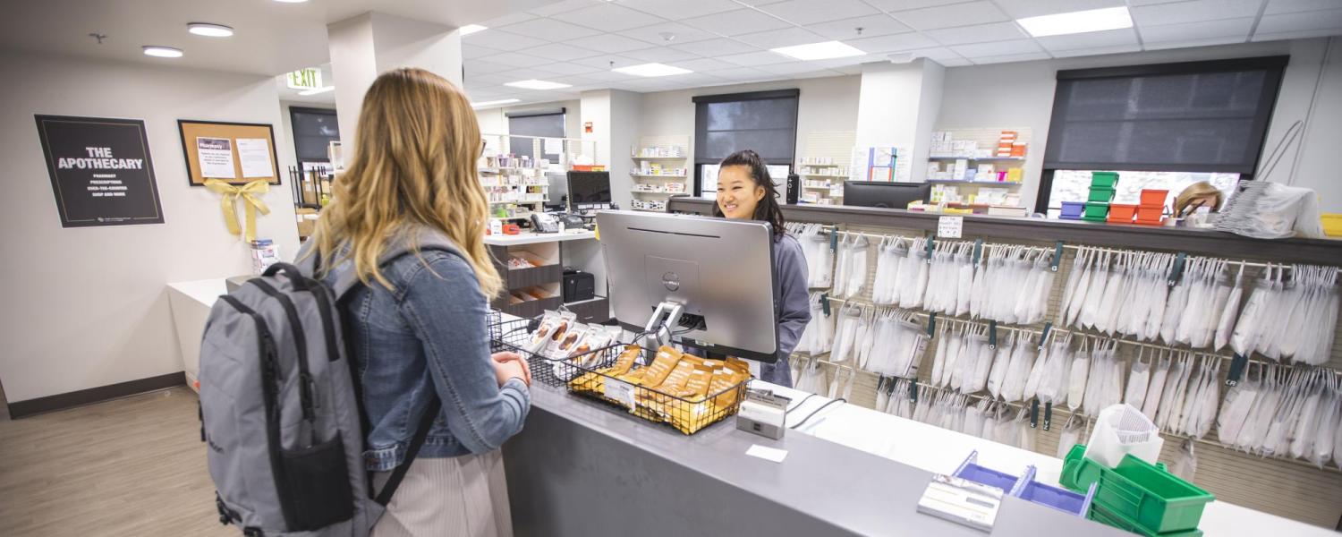 Students checking out at the Apothecary pharmacy